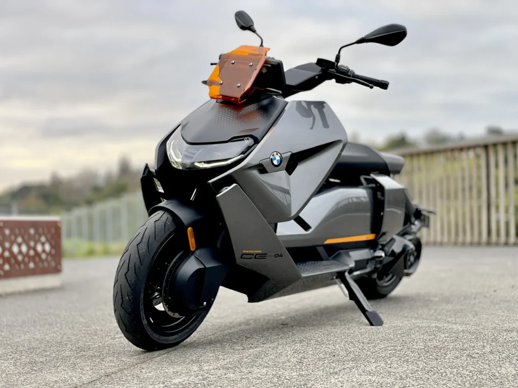 BMW CE 04 electric scooter three quarter front angle on pavement