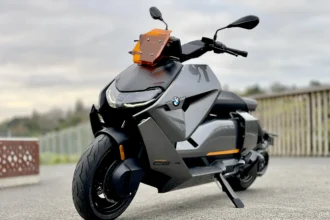 BMW CE 04 electric scooter three quarter front angle on pavement