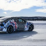 Rear view of BMW M electric Neue Klasse prototype during winter testing on an icy track