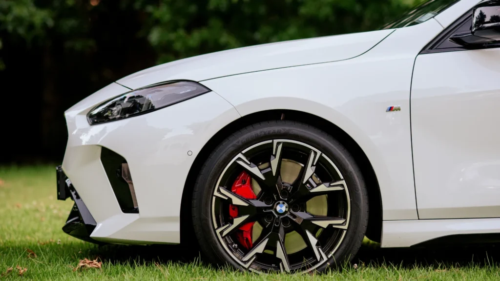 Close-up of BMW M135i alloy wheel with red M Sport brake caliper