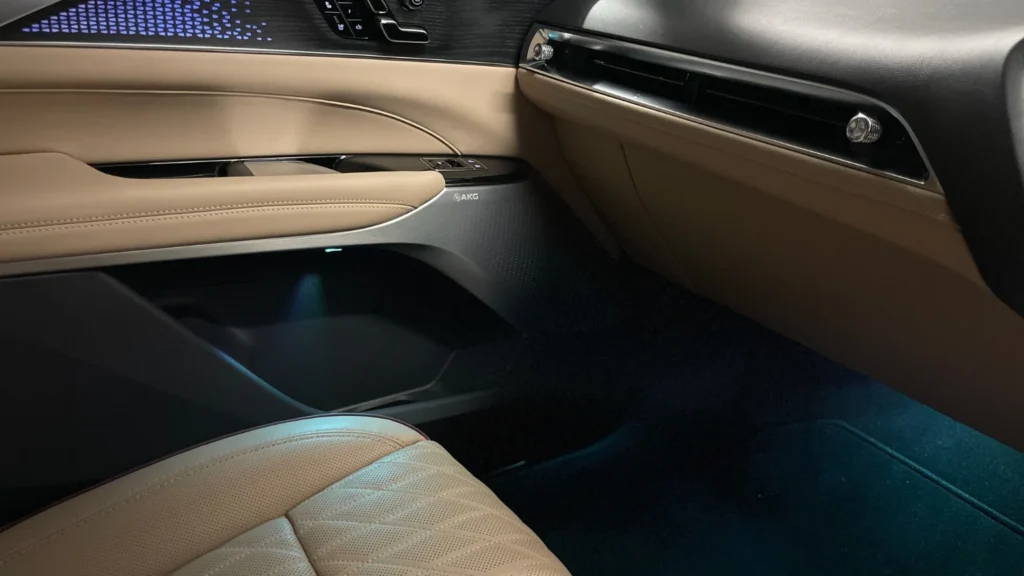 Interior door speaker and trim detail in the Cadillac Lyriq featuring AKG audio branding