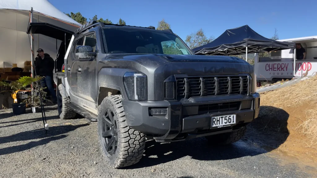 Kia Tasman front three-quarter view at off-road display event