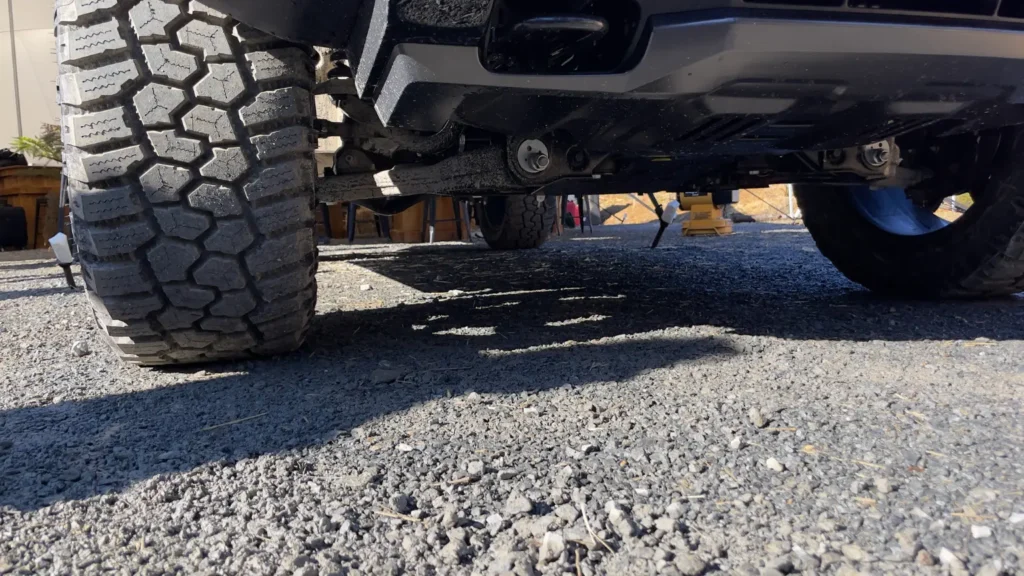 Kia Tasman underbody view showing ground clearance and suspension