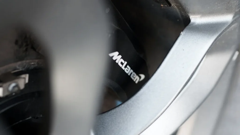 McLaren 650S alloy wheel with branded brake caliper close-up