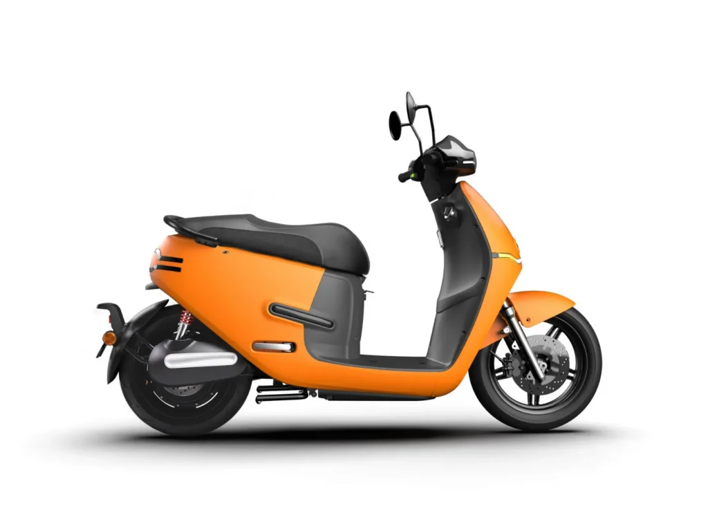 Orange electric scooter side profile isolated on a clean white background