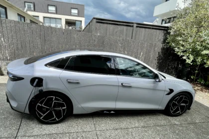 BYD Seal side profile charging at home driveway wall charger