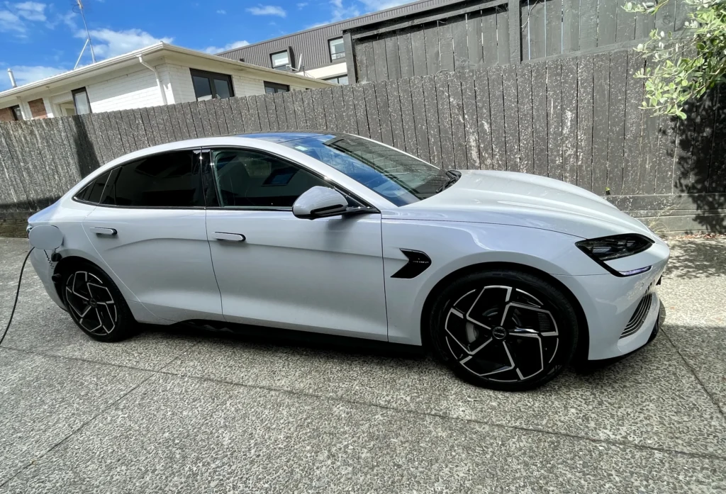 BYD Seal full side view electric sedan parked in residential driveway NZ