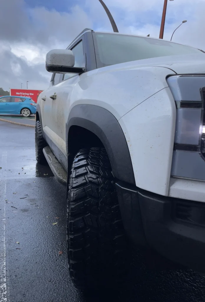 BYD Shark 6 close-up front side panel and tire tread detail