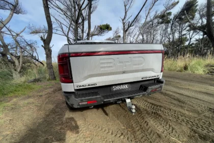 BYD Shark 6 rear angle showing tailgate and tow setup outdoors