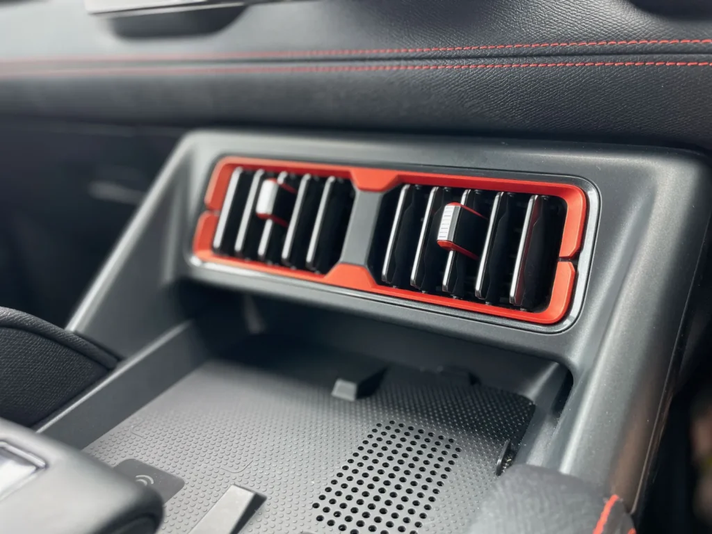 BYD Shark 6 interior air vents with red accents and dashboard detail